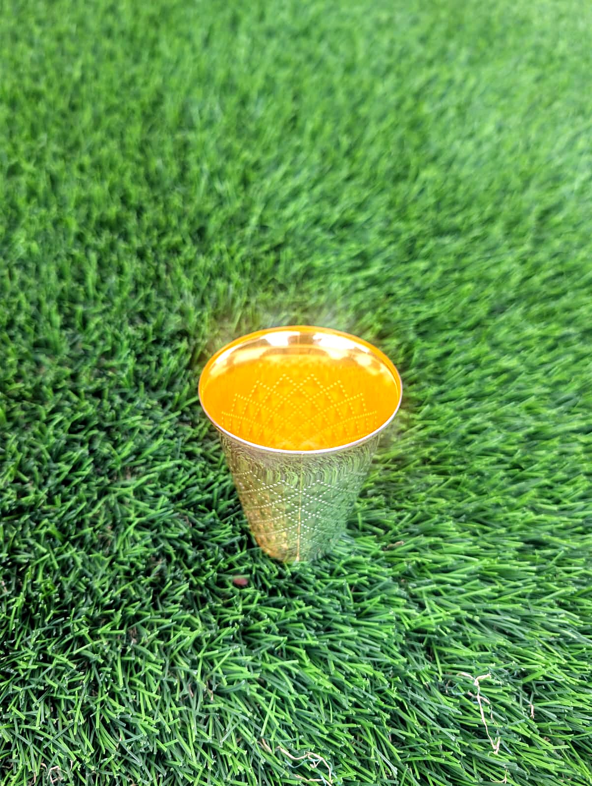 Kiddush cup on grass